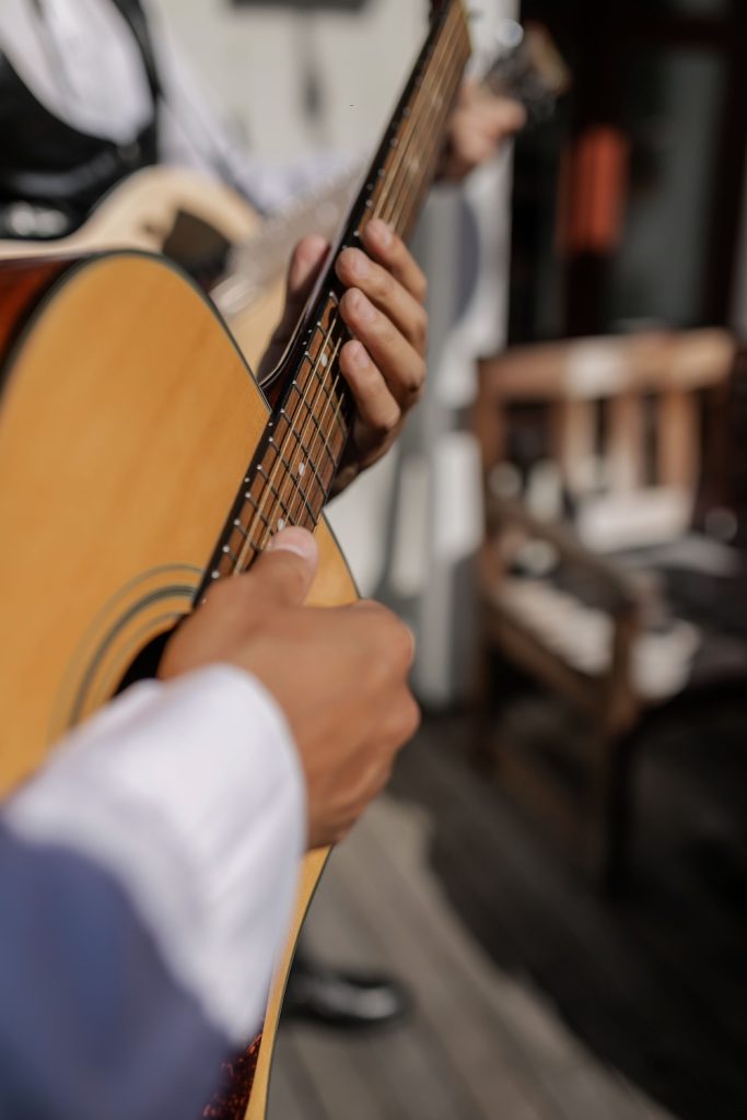 Wedding musician playing a guitar