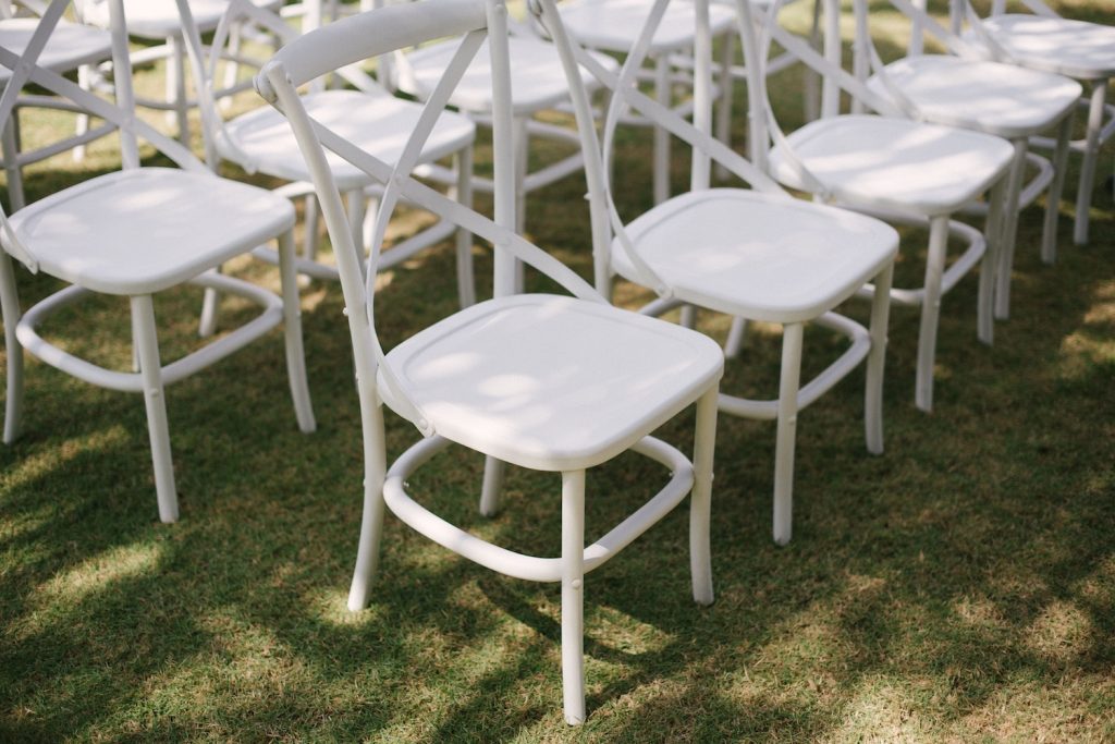 Wedding chairs lined up on the grass
