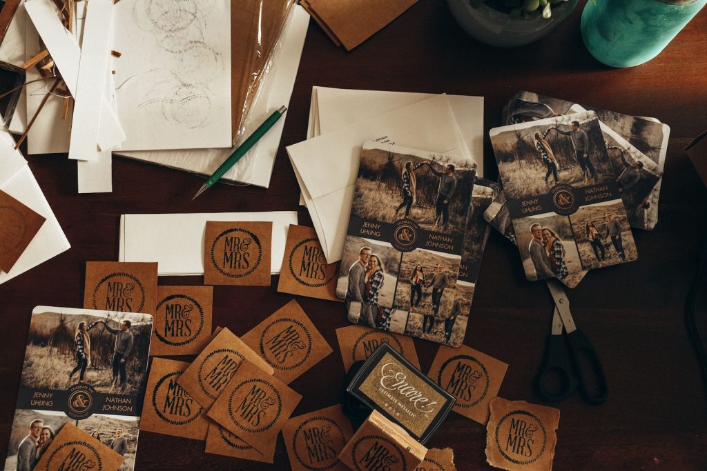 Sustainable wedding stationery laid out on a table