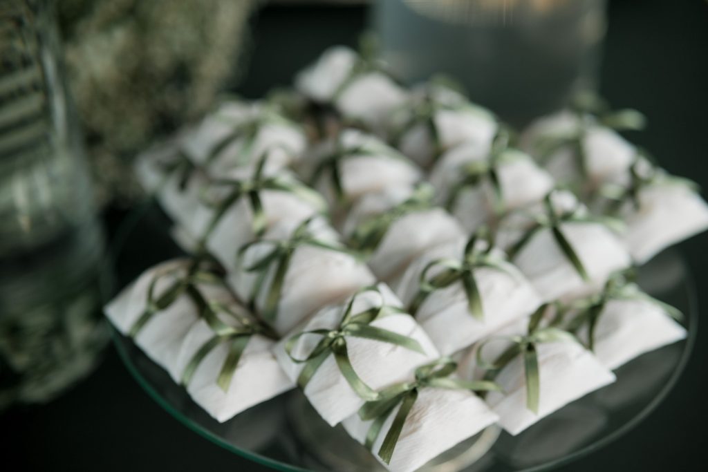 Stack of sustainable wedding favours on a table