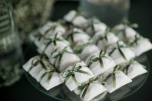 Stack of sustainable wedding favours on a table