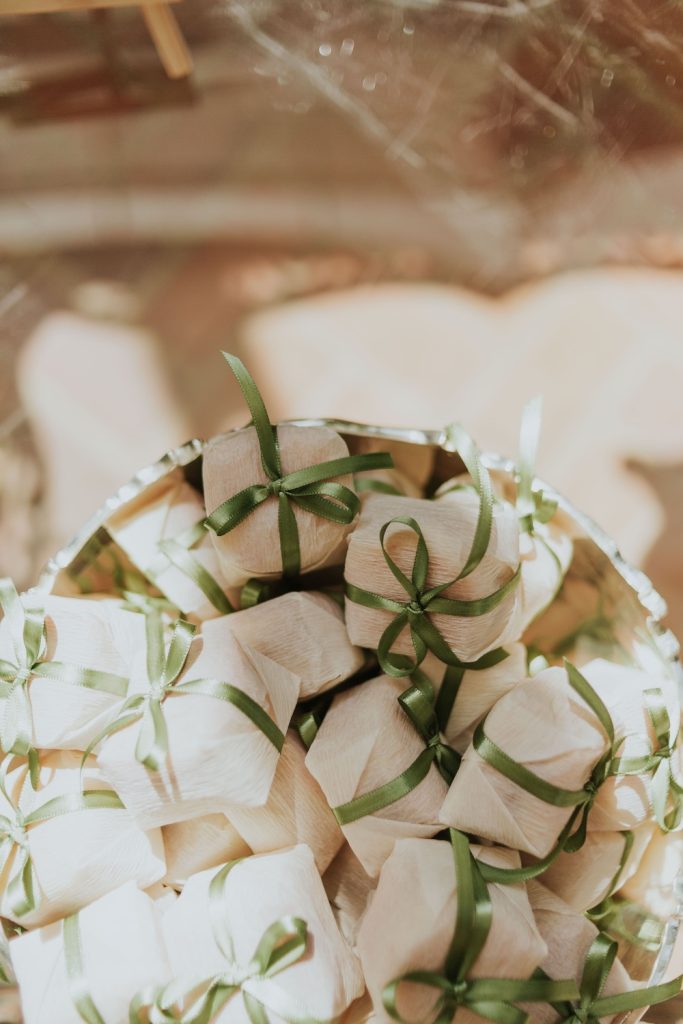 Stack of wedding party favours sat in a bowl on a table