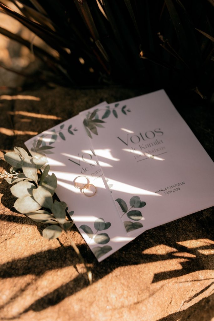 Eco-friendly wedding stationary laying on a wooden surface