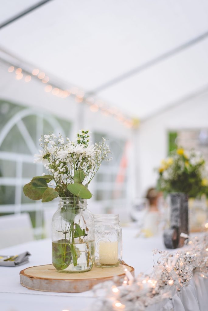 DIY Eco-Friendly Wedding Centerpiece Idea sat in the middle of a wedding table
