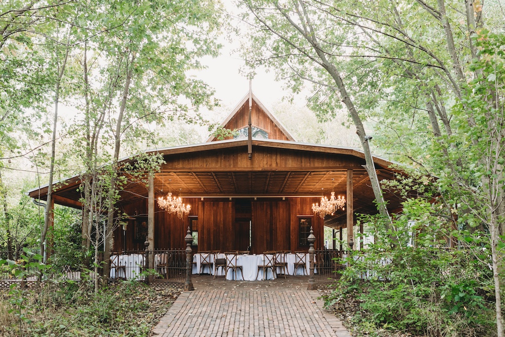 Sustainable Wedding Venue with tables surrounded in trees