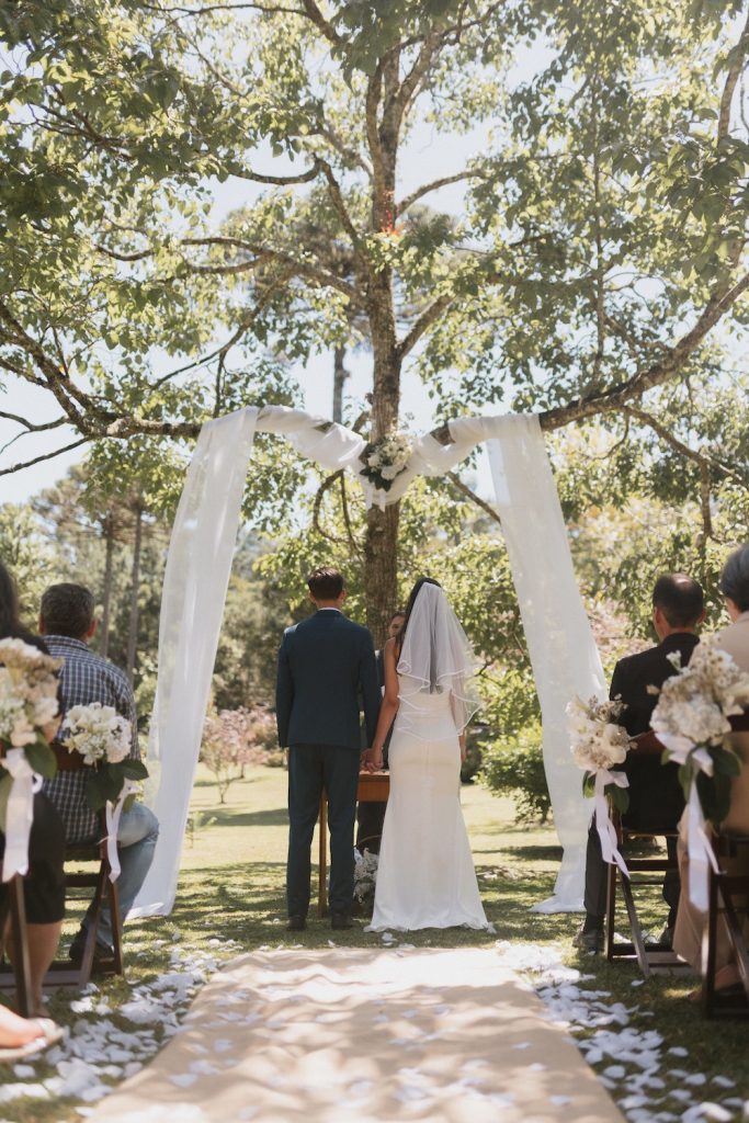 Bride and groom standing at the front of their wedding ceremony